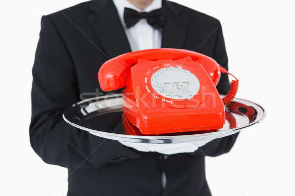 2742892_stock-photo-waiter-holding-red-dial-phone-on-silver-tray.jpg