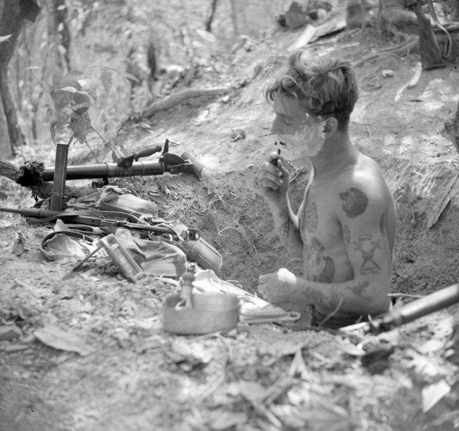 British soldier in his foxhole_ Sten gun_Burma, April 1945.jpg
