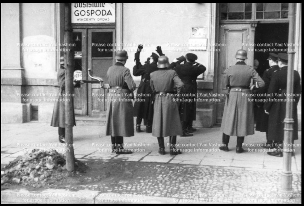 Krakow, Poland, German and Polish police arresting two suspects, 1941.jpg
