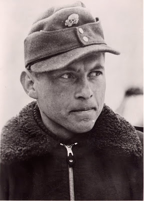 Michael Wittmann wearing Feldmütze & fur coat.jpg