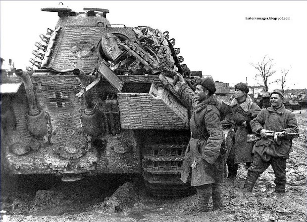 Soviet soldiers inspect a Panther tank captured in Uman, March 13, 1944..jpg