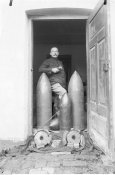 Austro-Hungarian soldier with artillery shells.jpg