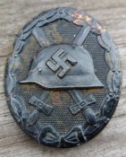 Знак за ранение черный.