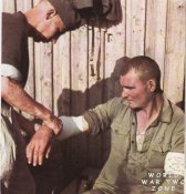 The man having his wound dressed is a volunteer out of the ranks of Soviet POWs.jpg