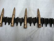 MG - фрагмент ленты с ММГ патронами (антураж).