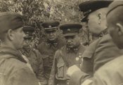 А.И.Лизюков и его сын Юрий (второй слева)-Б.Верейка 1942.jpg