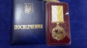 Номерная медаль "За Благодійність" с чистім документом