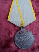 За боевые заслуги.