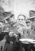 Tasting the soup. On the left Hubert Van Eyser who was to be killed in action at Cherkassy as a .jpg