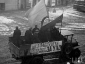 Propaganda truck rolling through streets of city.jpeg