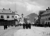 Hungarian soldiers marching down village street..jpeg