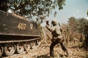 Government soldiers tossing grenade.jpg