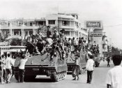 Khmer Rouge guerrillas atop their US-made armored vehicles enter Phnom Penh April 1975.jpg