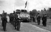Khmer Rouge soldiers listening to their commander for advice near the tank.jpg