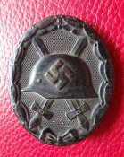 Знак "За ранение 1939" в чёрном.