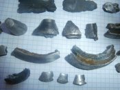 Осколки с надписями с боевых позиций .