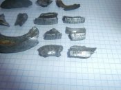 Осколки с надписями с боевых позиций .