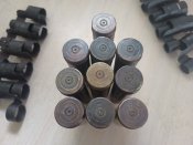 10 гильз ВЯ - 23 и 10 звеньев ленты.