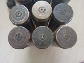 10 гильз ВЯ - 23 и 10 звеньев ленты.