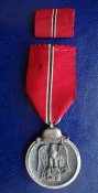Медаль "За зимнюю кампанию на Востоке 1941/42" + фельдшпанга.