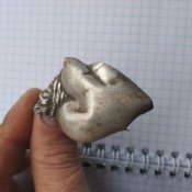 Срібна католицька підвіска.