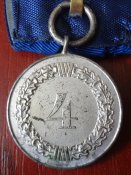 Медаль на колодке «За 4 года службы в Люфтваффе».