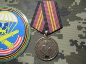 Шеврон і медаль 76 дивізії ВДВ, Бучанські злодії