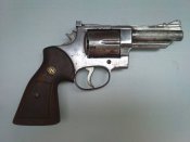 Револьвер похож на Смит-Вессон Ммг, Схп. (Smith & WESSON)