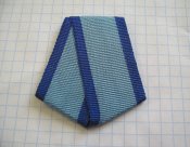 Колодка из алюминия с лентой к ордену Трудового Красного Знамени .