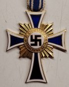 Материнський хрест в золоті