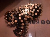 Стрічка з гільз 12.7*99 ( 82 гільзи + ланки )