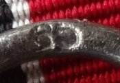 Остмедаль. Клеймо "65".