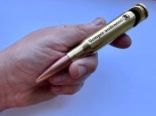 Открывашка для бутылок из макета патрона 50 bmg лазерная гравировка