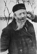 Jew in Hrubieszow endures the humiliation of having his beard cut off.jpg
