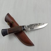 Мисливський ніж в шкіряних ножнах