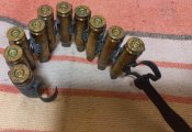 Гільзи 7,62 на кулеметній стрічці. Латунь