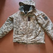 Тепла зимова тактична куртка з капюшоном...