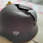 Три німецькі шоломи з декалями.