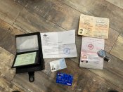 Документи паспорт,військовий квиток ,годинник ,карточка окупанта