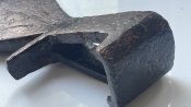 Велика сокира з квіткою чи тризубом