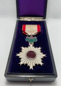 Орден Висхідного сонця 6 ступеня.