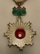 Орден Висхідного сонця 6 ступеня.