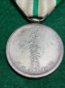Памʼятна медаль на відзначення відновлення столиці Токіо після землетрусу.