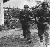 Waffen SS move out,leaving Russian POW's behind.Battle of Kursk.jpg