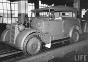A new Fiat car sitting on the assembly line at the Fiat Auto factory 1940.jpeg