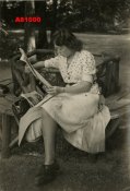 1942 YOUNG WOMAN READING NEWSPAPER.JPG