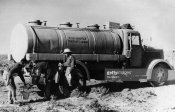 From a tanker truck of the Italian Air Force Italian soldiers providing water supplies.jpg