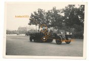 15cm sIG33 gun being towed by a SdKfz 10-4 Halbkette with 7.92mm  Zwillings MG mount of LAH Div-.JPG