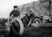 6_Mechanics repair truck tyres Albania February 1941.jpg