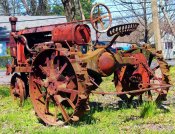Rusted-Red-Antique-Tractor-With-Metal-Wheels.jpg